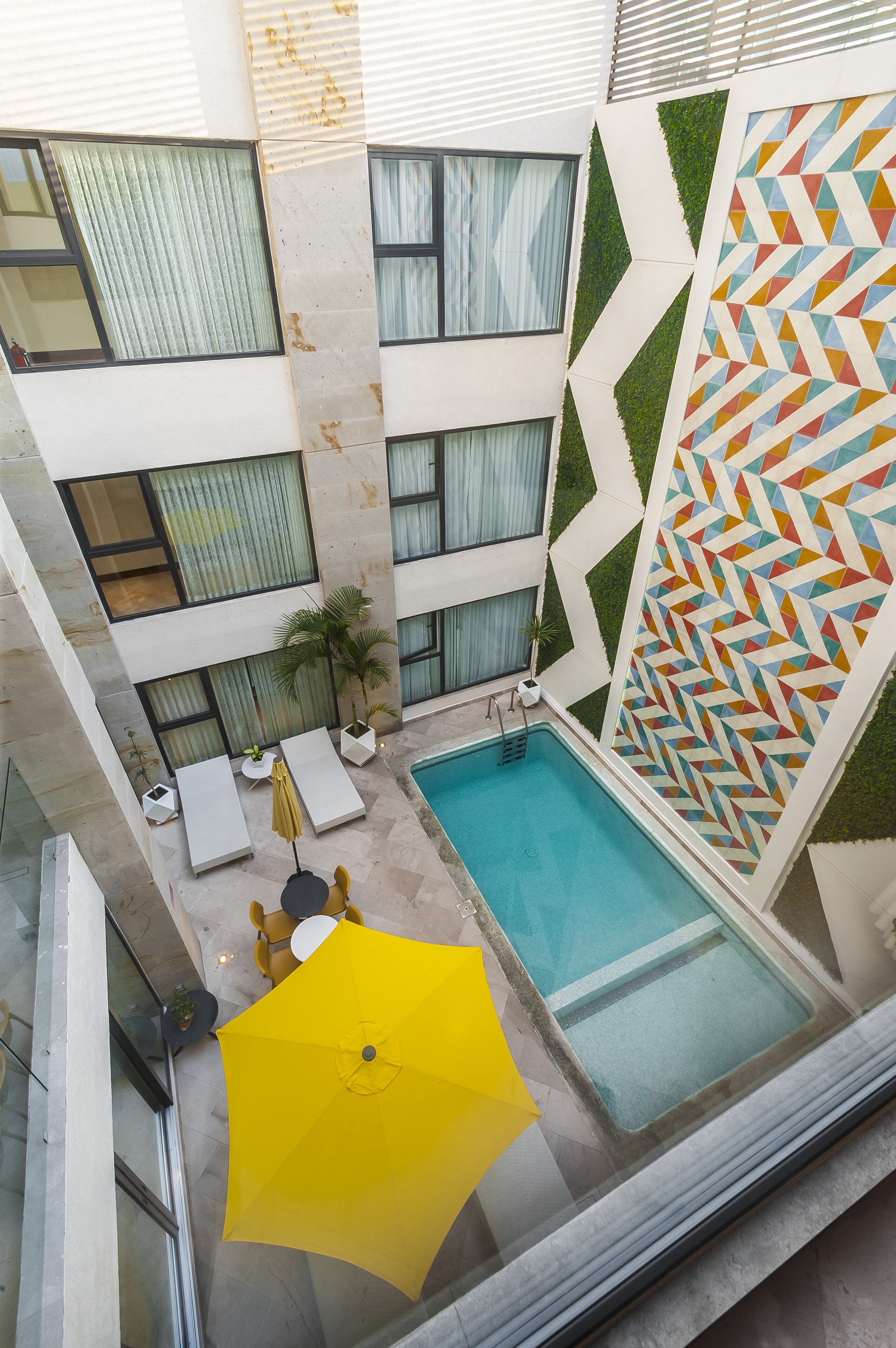 Outdoor pool, open 9:00 AM to 9:00 PM, pool umbrellas, pool loungers