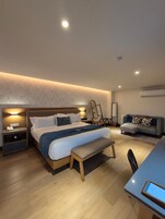 Junior Suite, 1 King Bed | In-room safe, laptop workspace, iron/ironing board, free WiFi