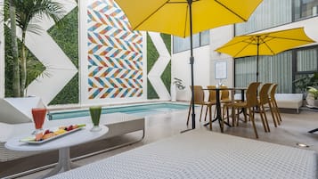 Outdoor pool, open 9:00 AM to 9:00 PM, pool umbrellas, sun loungers