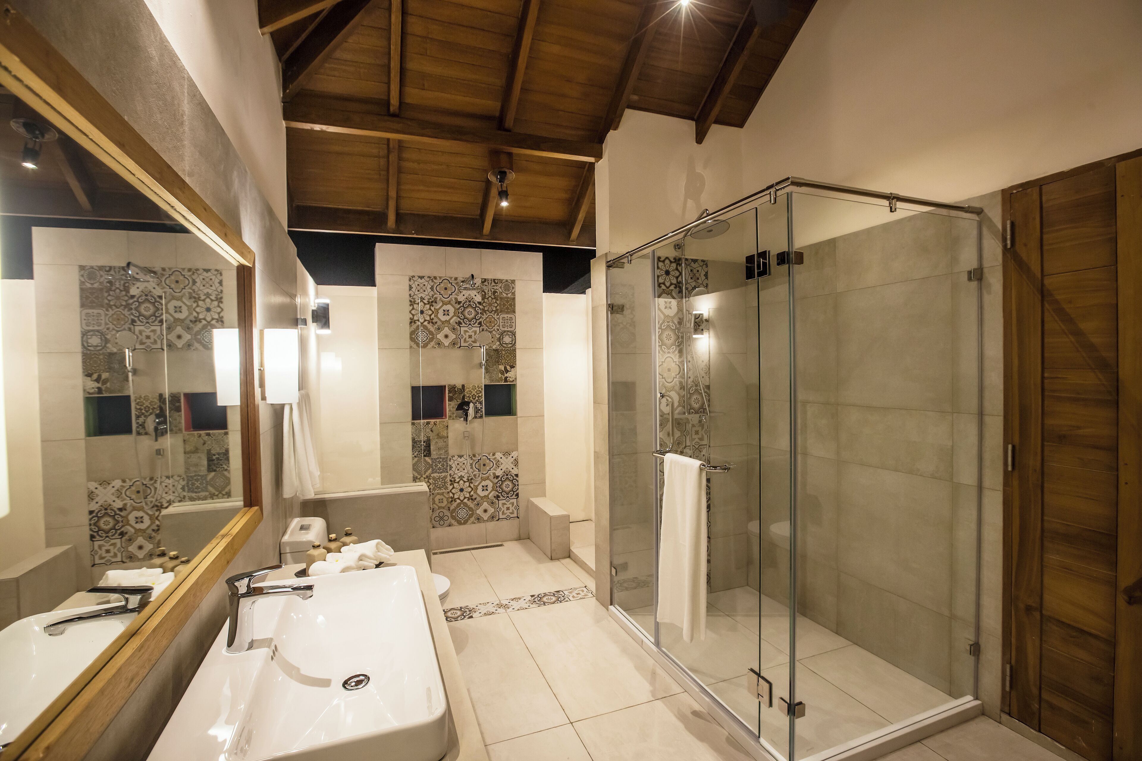 water villa sunset view | bathroom | free toiletries, hair dryer, bathrobes, slippers