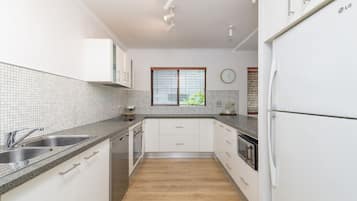 2 Bedroom Apartment Pool View | Private kitchen | Full-sized fridge, microwave, oven, stovetop