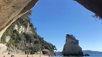 Beach nearby, white sand, beach towels