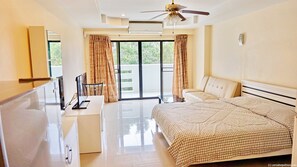 Comfort Studio Suite, 1 King Bed, Kitchen, Pool View | Living area | 40-inch flat-screen TV with cable channels, TV - Yensabai Condotel (Pattaya)