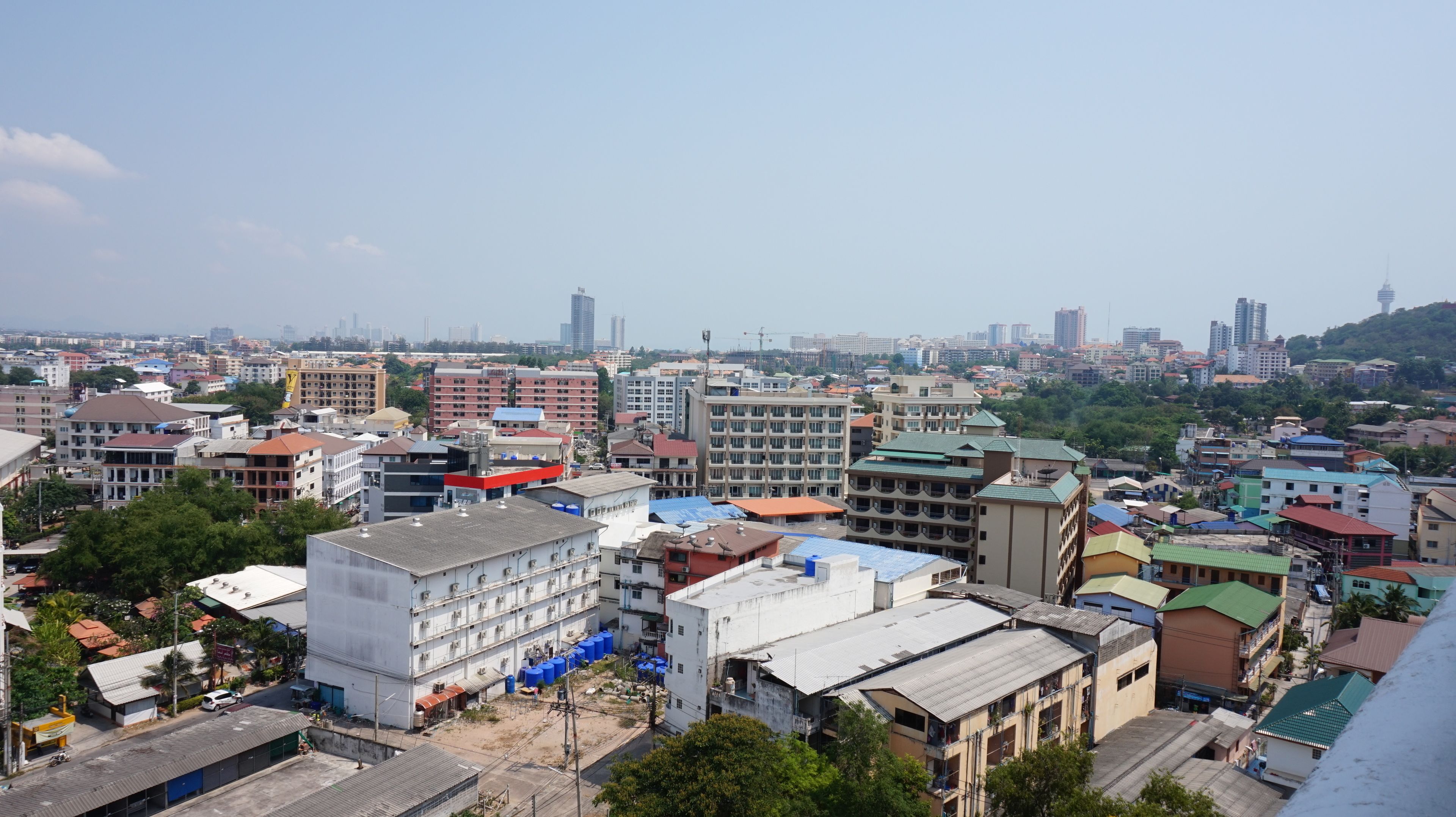 A cityscape with various buildings, including residential and commercial structures.