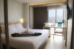 Habitación Deluxe | 1 dormitorio, caja fuerte, escritorio y sistema de insonorización