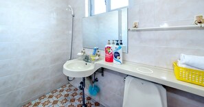 Combined shower/tub, free toiletries, hair dryer, slippers