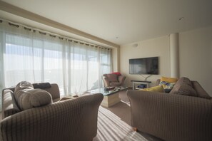 Apartment, 2 Bedrooms, Ocean View | Living area | Flat-screen TV