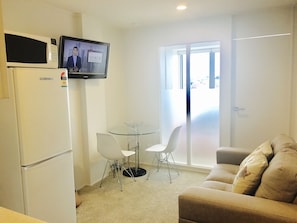 Apartment, 2 Bedrooms, Harbor View | Living area | Flat-screen TV