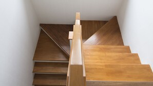 A wooden staircase with a skylight above. - Maximum Land & House with WiFi (Udon Thani)