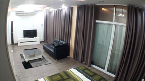 Comfort Single Room, 1 King Bed, City View | Living area | 55-inch flat-screen TV with cable channels, TV - Maximum Luxury Apartment (Udon Thani)