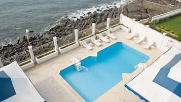 Outdoor pool, open 8:00 AM to 8:00 PM, pool umbrellas, pool loungers
