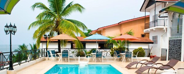 Outdoor pool, open 8:00 AM to 8:00 PM, pool umbrellas, pool loungers