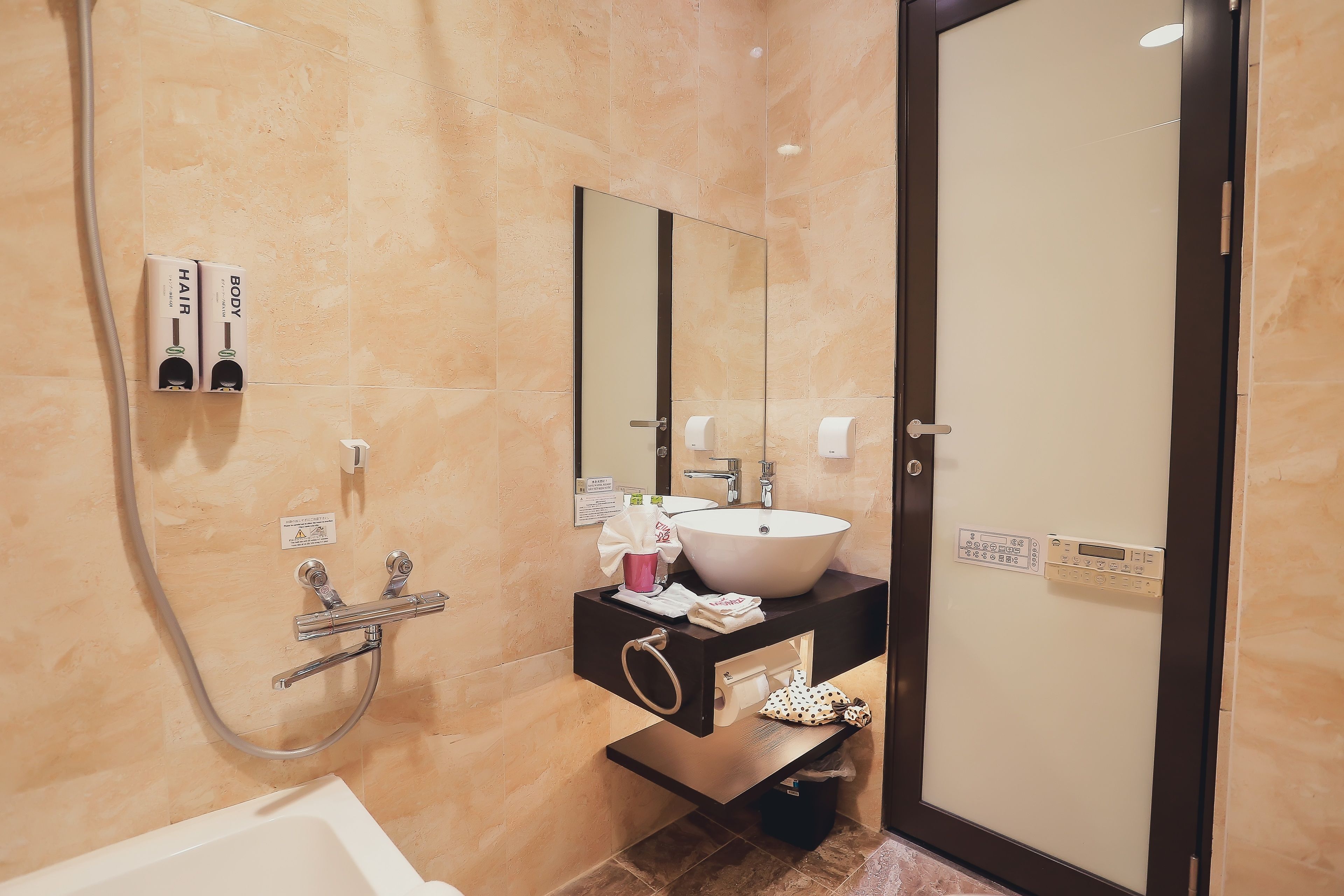 single standard | bathroom | combined shower/bathtub, free toiletries, hair dryer, bathrobes