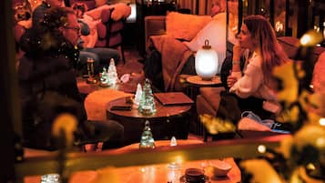 Relax in a cozy lounge area with sofas and chairs, perfect for conversation and quiet activities.