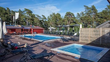 Outdoor pool, open 10:00 AM to 6:00 PM, pool loungers
