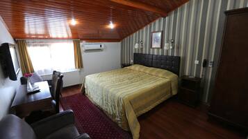 Premium bedding, desk, laptop workspace, soundproofing