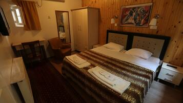 Premium bedding, desk, laptop workspace, soundproofing