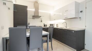 Deluxe Apartment, 2 Bedrooms (Check-in online) | Private kitchen | Full-size fridge, microwave, stovetop, dishwasher