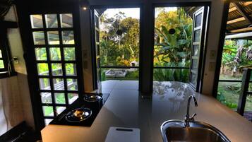 Full-sized fridge, stovetop, coffee/tea maker, cookware/dishes/utensils