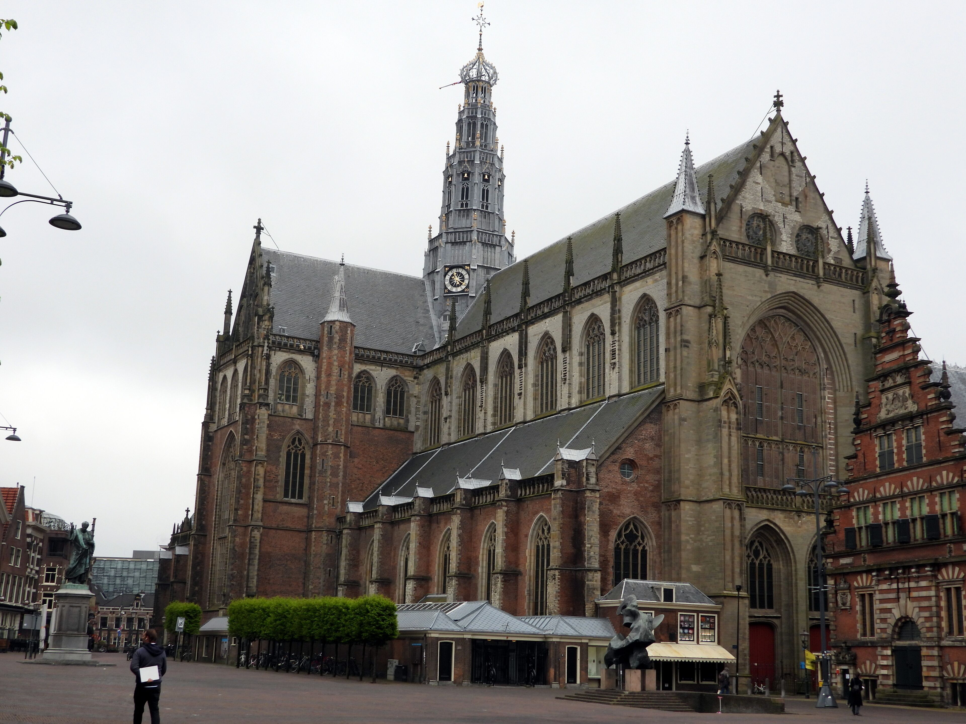 A historic building with a prominent clock tower and Gothic architecture.