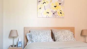 1 bedroom, desk, iron/ironing board, travel crib