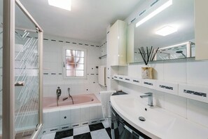 Bathtub, hair dryer, bidet, towels