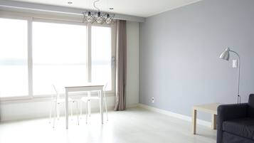 Deluxe Studio, Non Smoking, Beachfront | Living area | Flat-screen TV