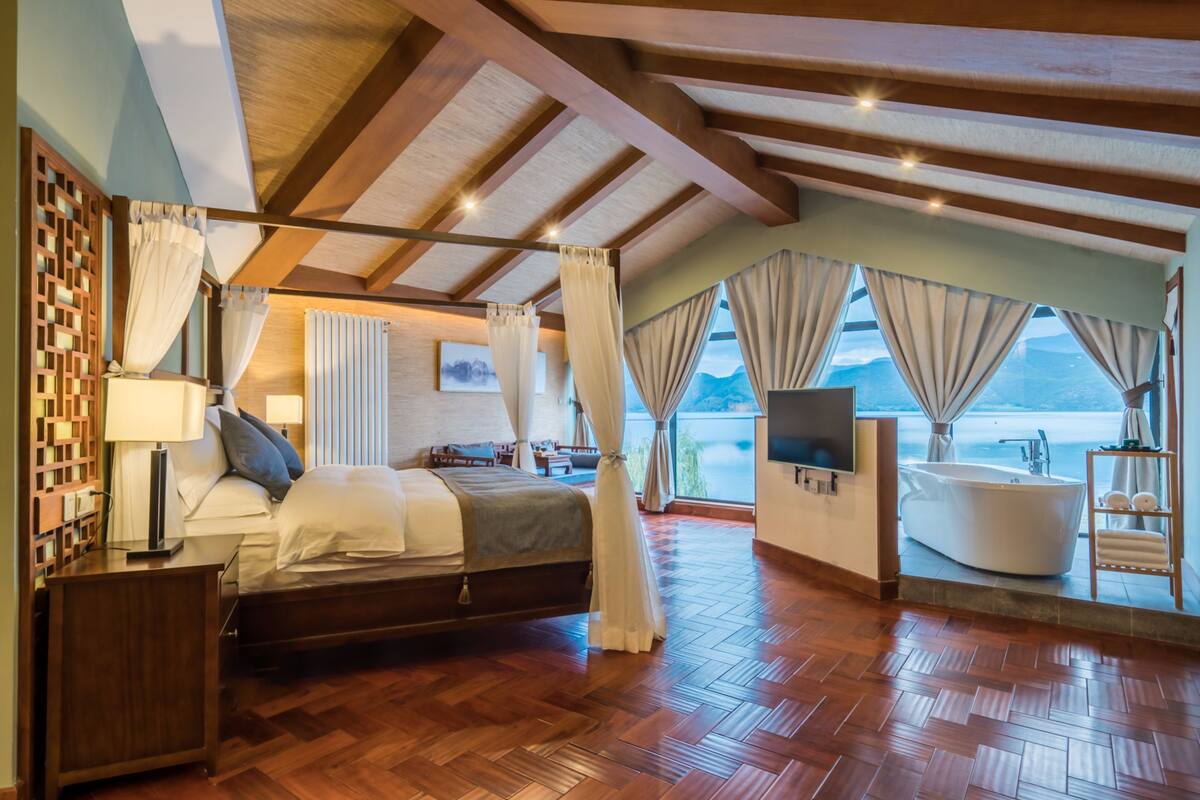 Luxury Suite, 1 Bedroom, Lake View | Minibar, blackout drapes, free WiFi