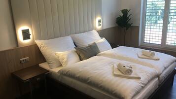 Deluxe Double or Twin Room | Minibar, in-room safe, desk, blackout drapes