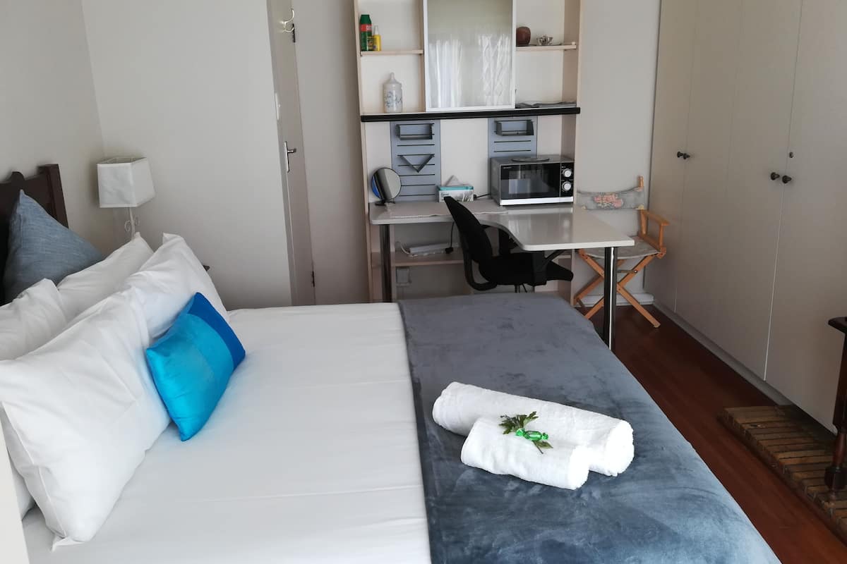 Economy Studio | Premium bedding, laptop workspace, blackout drapes, iron/ironing board