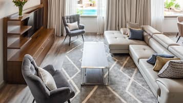 Deluxe Apartment, 1 Bedroom | Living room | 49-inch Smart TV with satellite channels, TV, Netflix