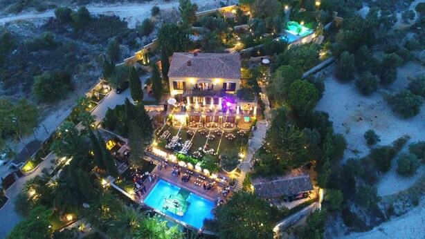 An aerial view of a resort with a large pool, outdoor dining area, and multiple guest rooms. - Villa Taraca Alacati Romantik Hotel (Cesme)