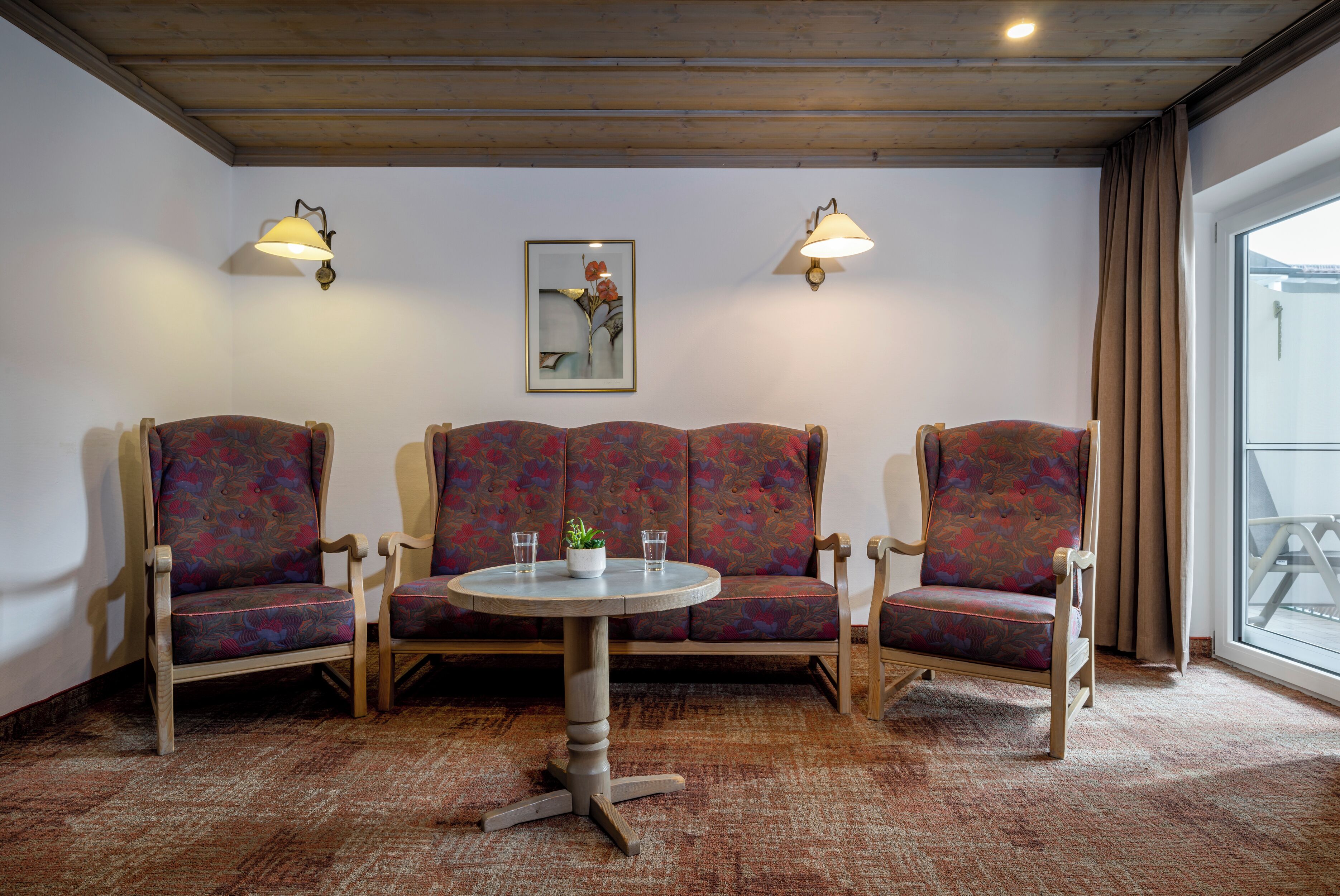 deluxe double room, balcony | living area | flat-screen tv