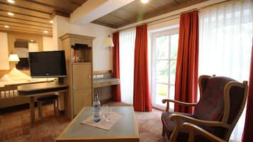 Deluxe Double Room, Balcony | Living area | Flat-screen TV