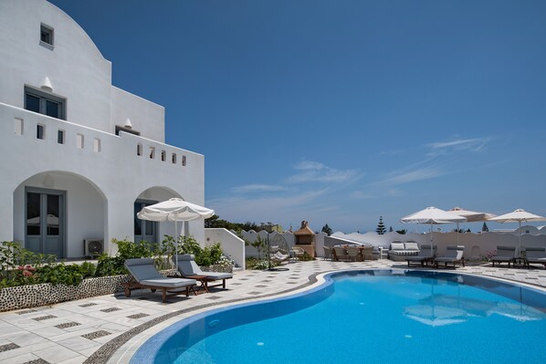 Seasonal outdoor pool, pool umbrellas, pool loungers