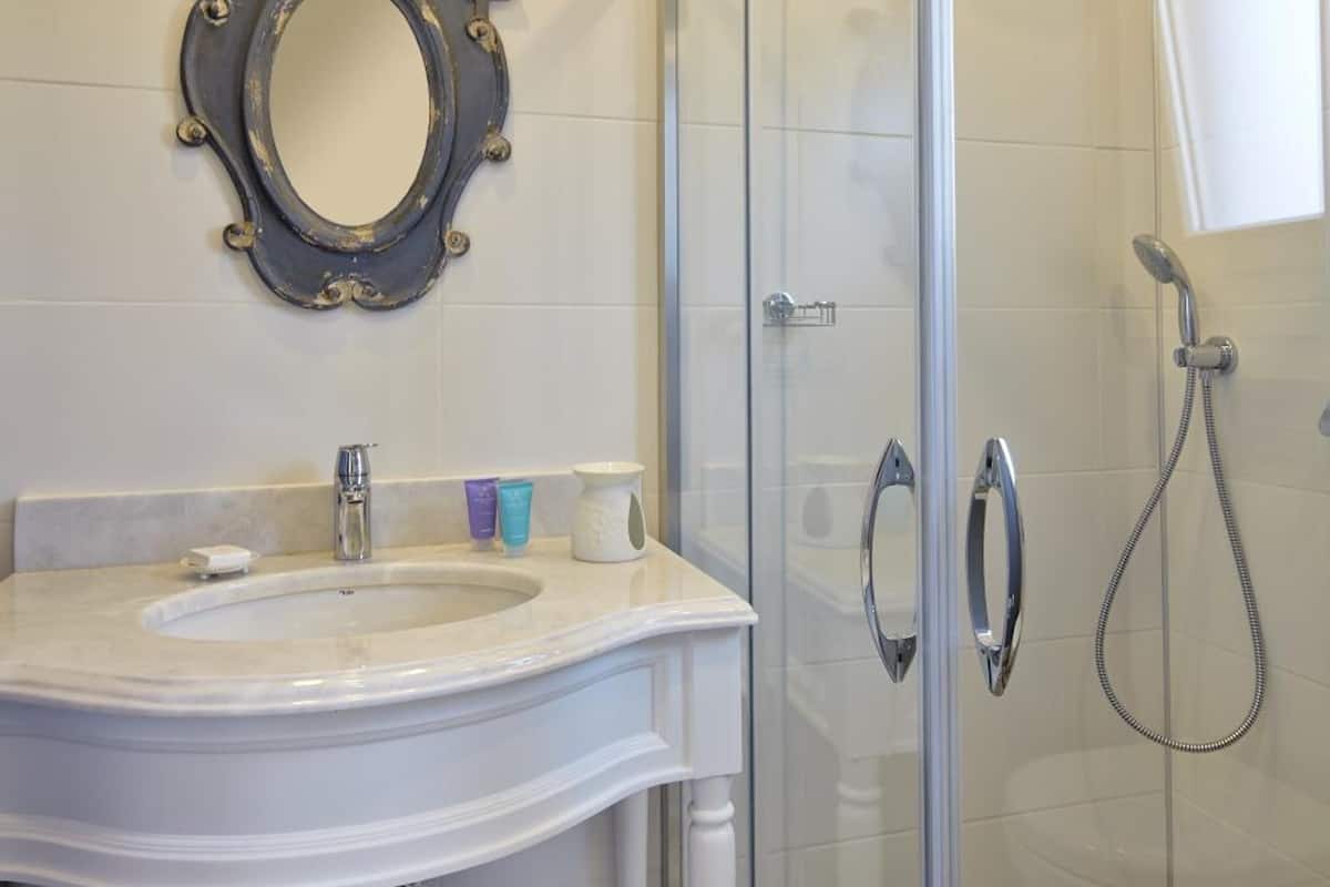 room | bathroom | shower, designer toiletries, hair dryer, slippers
