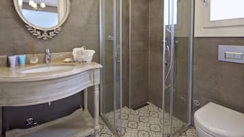 Shower, designer toiletries, hair dryer, slippers