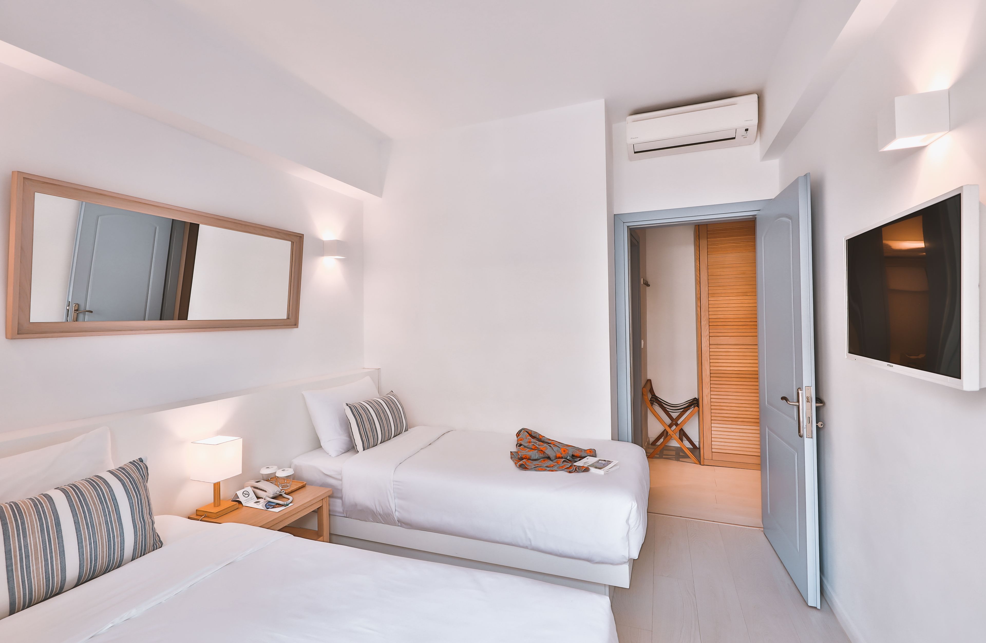 triple room, balcony | minibar, in-room safe, iron/ironing board, free wifi