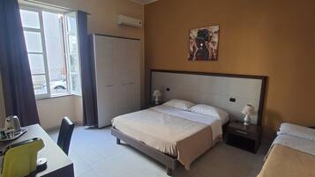 Triple Room | Minibar, in-room safe, desk, iron/ironing board