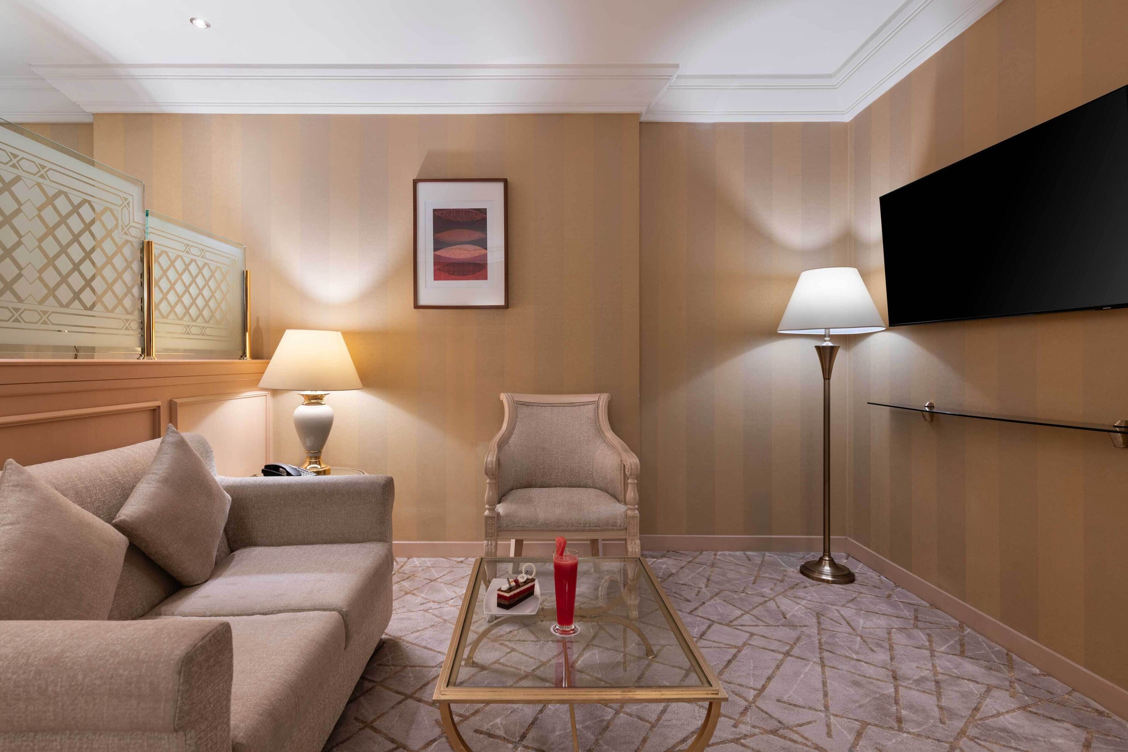 studio suite with two single beds | living area | 37-inch lcd tv with satellite channels, tv