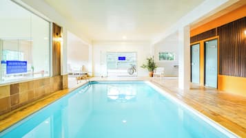 Indoor pool, outdoor pool, pool umbrellas, sun loungers