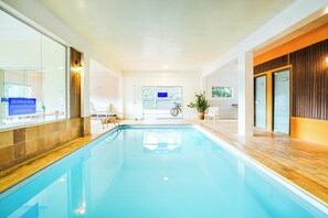 Indoor pool, outdoor pool, pool umbrellas, pool loungers