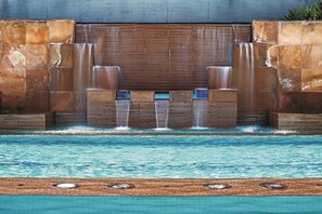 Outdoor pool, open 6:00 AM to 10:00 PM, pool loungers
