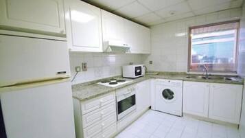 Two Bedroom, Double or Twin Bed | Private kitchen | Full-sized fridge, microwave, oven, coffee/tea maker