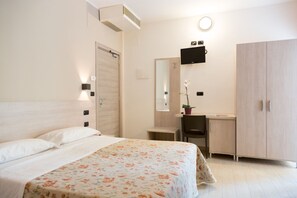 Family Room (1st floor - no elevator) | Minibar, in-room safe, desk, laptop workspace - Hotel Saint Tropez (Pineto)