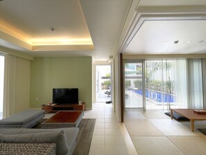 ORCHID | Living area | 50-inch flat-screen TV with digital channels - Ahman Suite Villa Sumuide (Nago)