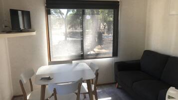 Basic Cabin, 2 Bedrooms | Living area | Flat-screen TV
