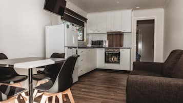 Deluxe Cabin, 1 Bedroom | Living area | Flat-screen TV