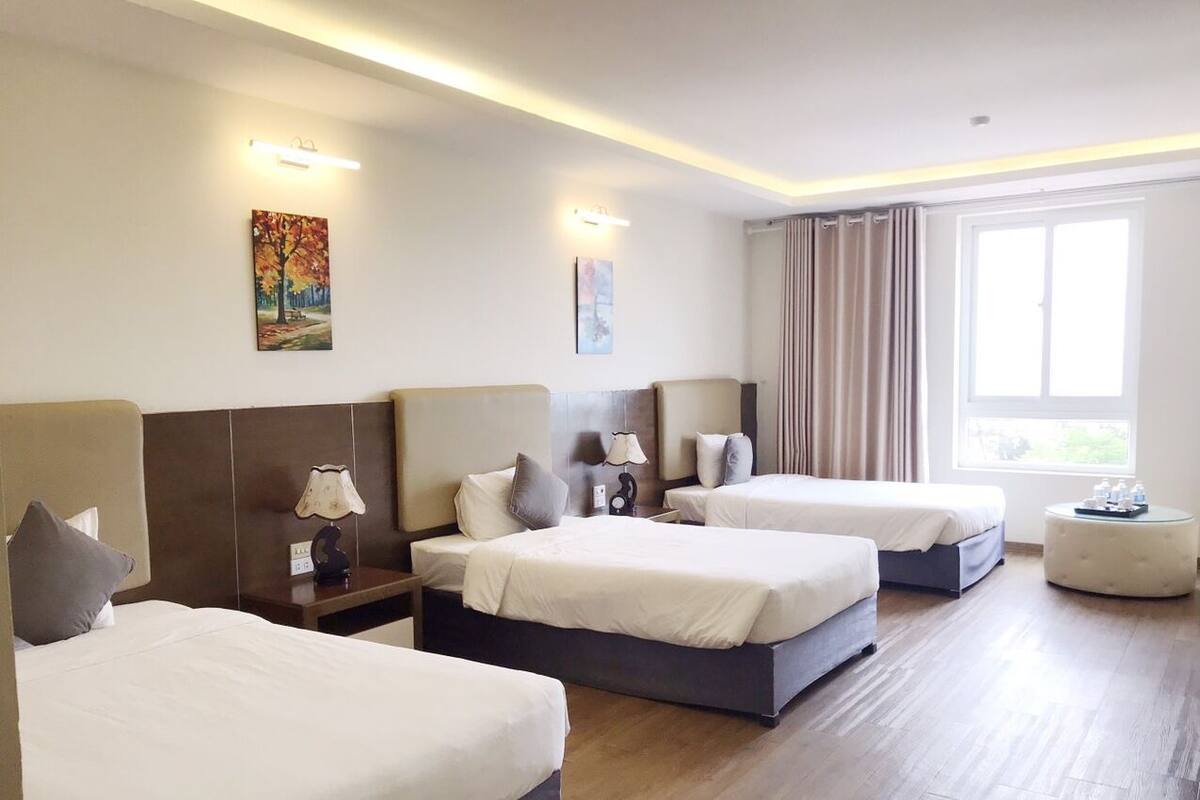 Deluxe Triple Room, 1 Bedroom, Non Smoking, Beach View | Minibar, in-room safe, desk, blackout drapes