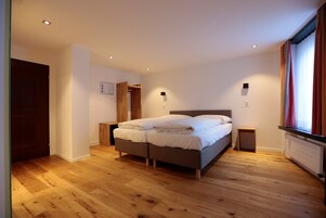 Desk, blackout curtains, soundproofing, cots/infant beds